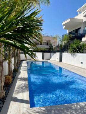 Air-conditioned Elisa Apartment with spacious sunroof lounge and swimming pool